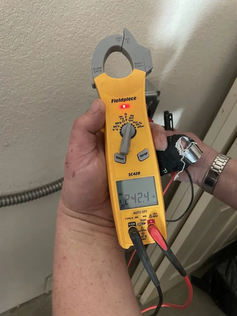 Voltage testing with clamp meter during Electrical Installation Services in Parksdale